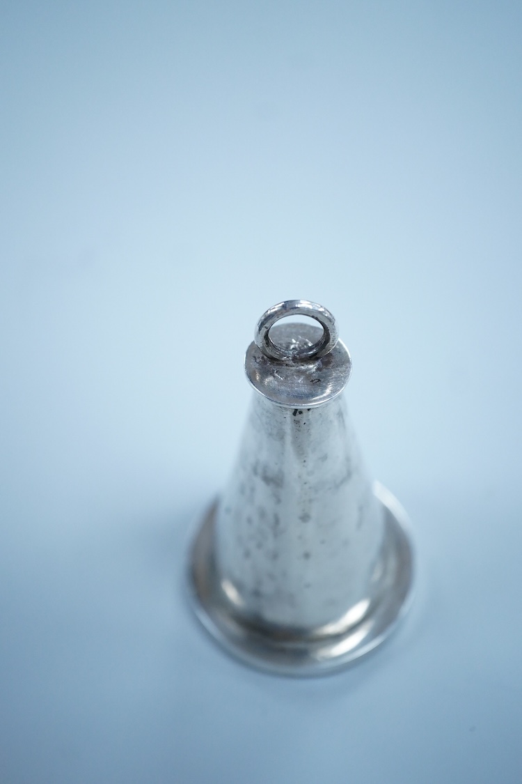 An Islamic white metal seal, of conical form with small ring handle, overall 83mm, 135 grams.